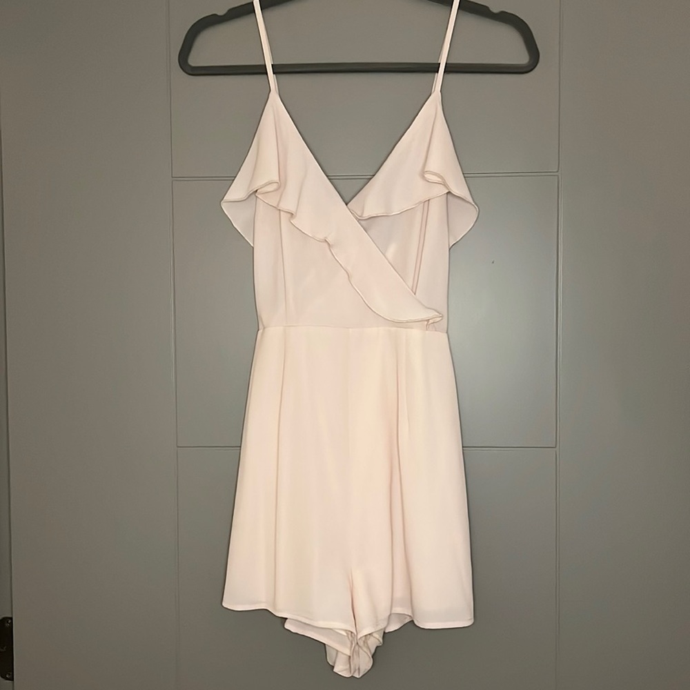 Pale pink romper. Size medium.